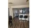 Kitchen with breakfast bar, gray vinyl flooring, and view into living room at 1920 Walnut Ave, Las Vegas, NV 89101