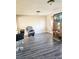 Living room featuring gray vinyl flooring and a media console at 1920 Walnut Ave, Las Vegas, NV 89101