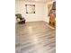 Living room with gray vinyl flooring and a large mirror at 1920 Walnut Ave, Las Vegas, NV 89101