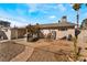 Backyard with gravel, stone patio, and exercise equipment at 1920 Wendell Ave, Las Vegas, NV 89101