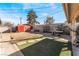 Landscaped backyard with patio, shed, and grassy area at 1920 Wendell Ave, Las Vegas, NV 89101