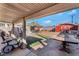 Backyard patio area with shed, exercise equipment, and table at 1920 Wendell Ave, Las Vegas, NV 89101