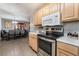 Open kitchen with stainless steel appliances and light cabinets at 1920 Wendell Ave, Las Vegas, NV 89101