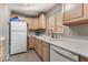 Kitchen features light wood cabinets and stainless steel appliances at 1920 Wendell Ave, Las Vegas, NV 89101