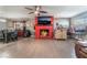 Living room with red brick fireplace, dining area and hardwood floors at 1920 Wendell Ave, Las Vegas, NV 89101