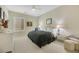 Spacious bedroom with a comfortable seating area and large windows at 2080 Twin Falls Dr, Henderson, NV 89044