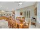 Bright dining area with wood table and chairs, adjacent to kitchen at 2080 Twin Falls Dr, Henderson, NV 89044