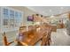 Dining area with wood table and chairs, open to kitchen and living areas at 2080 Twin Falls Dr, Henderson, NV 89044