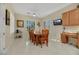 Bright dining area with wood table and chairs, near kitchen and windows at 2080 Twin Falls Dr, Henderson, NV 89044