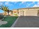 Single story house with three-car garage and artificial turf at 2080 Twin Falls Dr, Henderson, NV 89044