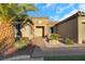 Landscaped front yard with palm tree and stone pathway at 2080 Twin Falls Dr, Henderson, NV 89044