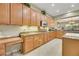 Spacious kitchen with light wood cabinets, granite countertops, and stainless steel appliances at 2080 Twin Falls Dr, Henderson, NV 89044