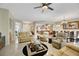 Open concept living room with views into kitchen and dining area at 2080 Twin Falls Dr, Henderson, NV 89044