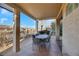 Covered patio with outdoor dining furniture and view at 2080 Twin Falls Dr, Henderson, NV 89044