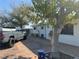 House exterior with parking and a tree in front at 2127 Crawford St, North Las Vegas, NV 89030