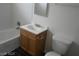 Clean bathroom with single sink vanity, toilet and bathtub at 2139 Crawford St, North Las Vegas, NV 89030