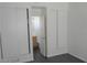 Bright bedroom with mirrored closet doors and grey flooring at 2139 Crawford St, North Las Vegas, NV 89030