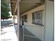 House exterior showcasing a covered walkway and security bars on windows at 2139 Crawford St, North Las Vegas, NV 89030