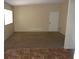 Living room featuring carpeted floors and a door at 2139 Crawford St, North Las Vegas, NV 89030