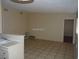 Living room with tile floors and a door leading to another room at 2139 Crawford St, North Las Vegas, NV 89030