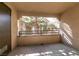 Private balcony overlooking a tree and neighboring building at 2200 S Fort Apache Rd # 2050, Las Vegas, NV 89117