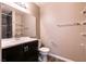 Bathroom with vanity, toilet, and shower with shelving at 2200 S Fort Apache Rd # 2050, Las Vegas, NV 89117