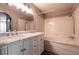 Bathroom with double vanity, marble countertop, and a bathtub at 2200 S Fort Apache Rd # 2050, Las Vegas, NV 89117