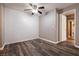 Bedroom featuring wood-look floors and ceiling fan, access to hallway at 2200 S Fort Apache Rd # 2050, Las Vegas, NV 89117