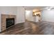 Spacious living room with fireplace and wood-look floors at 2200 S Fort Apache Rd # 2050, Las Vegas, NV 89117