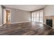 Living room with fireplace and wood-look flooring at 2200 S Fort Apache Rd # 2050, Las Vegas, NV 89117