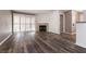 Living room with fireplace and wood-look flooring at 2200 S Fort Apache Rd # 2050, Las Vegas, NV 89117