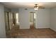 Well-lit bedroom with carpet and mirrored closet doors at 2616 Aracatuba Ave, Las Vegas, NV 89121