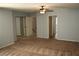 Bright bedroom featuring mirrored closet doors and carpet at 2616 Aracatuba Ave, Las Vegas, NV 89121