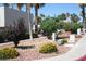 Landscaped community grounds with mature trees and flowering plants at 2616 Aracatuba Ave, Las Vegas, NV 89121