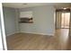 Living room with light gray walls and wood-look floors at 2616 Aracatuba Ave, Las Vegas, NV 89121