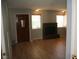 Living room with fireplace and wood-look floors at 2616 Aracatuba Ave, Las Vegas, NV 89121