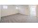 Large bedroom with grey carpet and access to a hallway at 2642 Snapdragon Falls Ave # 93, North Las Vegas, NV 89081