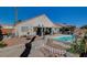 Spacious backyard with a pool, patio, and lush landscaping at 2715 Coral Cliffs Ct, North Las Vegas, NV 89031