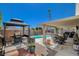 Inviting backyard with a sparkling pool, gazebo, and patio area, perfect for entertaining at 2715 Coral Cliffs Ct, North Las Vegas, NV 89031