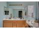 Double vanity bathroom with soaking tub and window at 2715 Coral Cliffs Ct, North Las Vegas, NV 89031