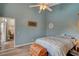 Bright bedroom with a queen bed and ceiling fan at 2715 Coral Cliffs Ct, North Las Vegas, NV 89031