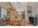 Open concept dining area with wood floors and kitchen view at 2715 Coral Cliffs Ct, North Las Vegas, NV 89031