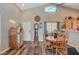 Charming dining area with jukebox and wood floors at 2715 Coral Cliffs Ct, North Las Vegas, NV 89031