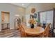 Cozy dining area with jukebox and sunflower centerpiece at 2715 Coral Cliffs Ct, North Las Vegas, NV 89031