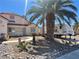 Landscaped front yard with a travel trailer and desert plants at 2715 Coral Cliffs Ct, North Las Vegas, NV 89031