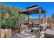 Gazebo with grill and outdoor seating at 2715 Coral Cliffs Ct, North Las Vegas, NV 89031