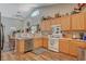 Bright kitchen with wood cabinets and stainless steel appliances at 2715 Coral Cliffs Ct, North Las Vegas, NV 89031