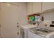 Laundry room with washer, dryer, and cabinets at 2715 Coral Cliffs Ct, North Las Vegas, NV 89031