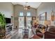 Open living room with hardwood floors and a view of the backyard pool at 2715 Coral Cliffs Ct, North Las Vegas, NV 89031