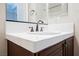 Bathroom vanity with a white sink and dark wood cabinets at 2768 Liberation Dr, Henderson, NV 89044